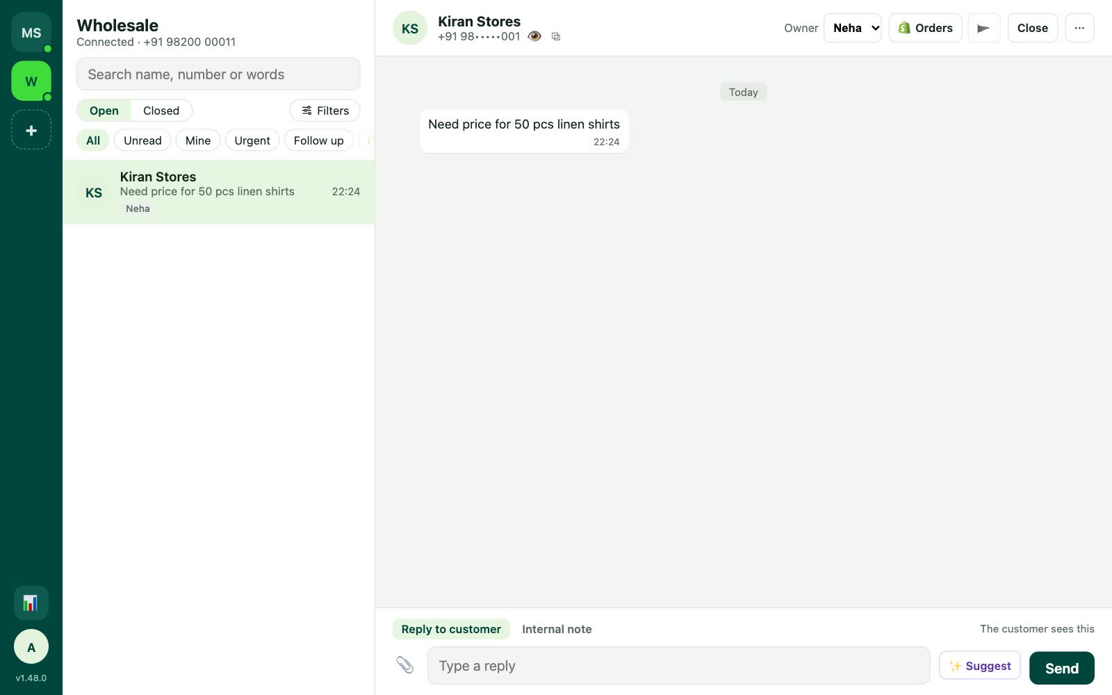 The inbox with two WhatsApp numbers on the left rail, showing the wholesale number’s chats